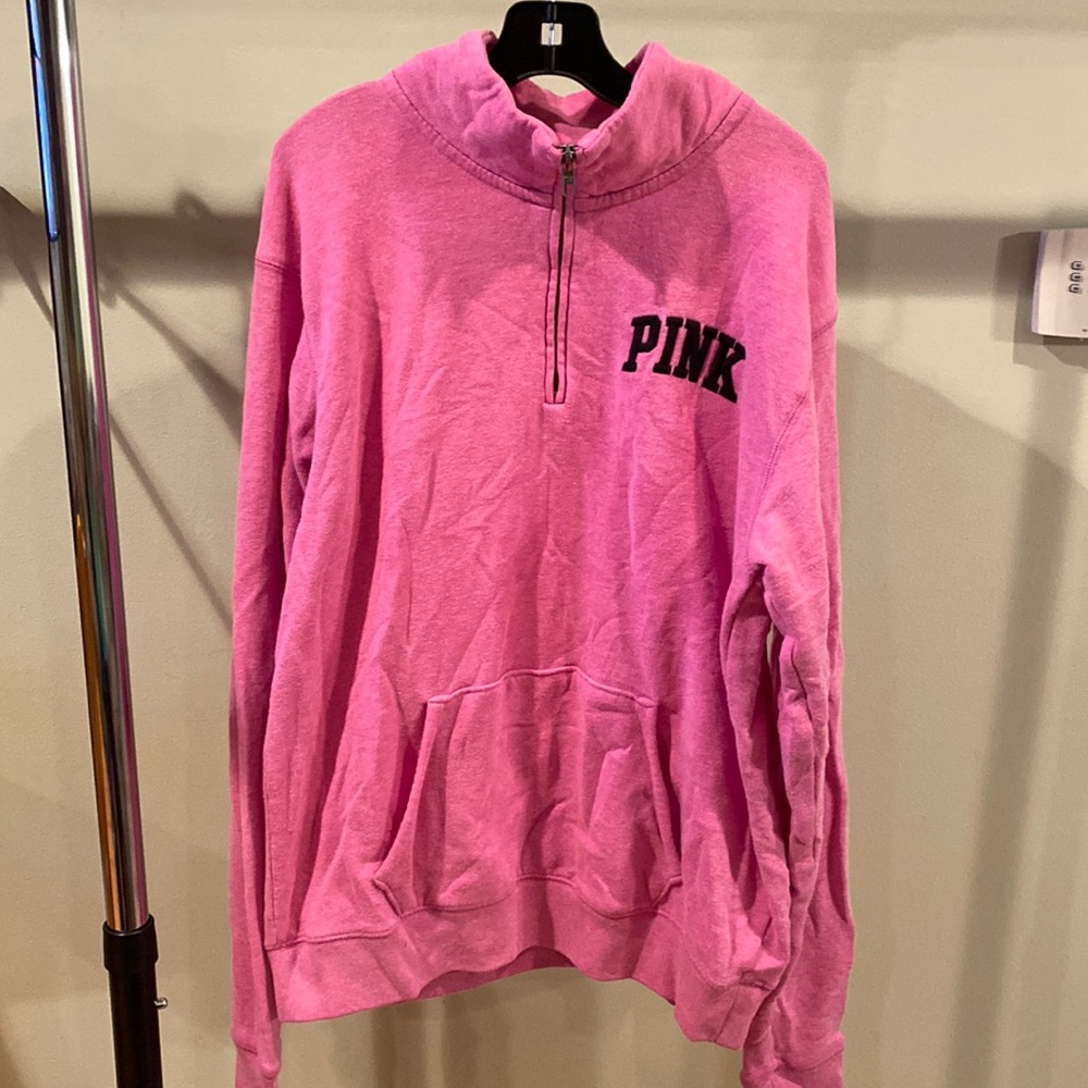 pink 1/4 zip sweatshirt. Lightly worn. Size XS but fits as a small.